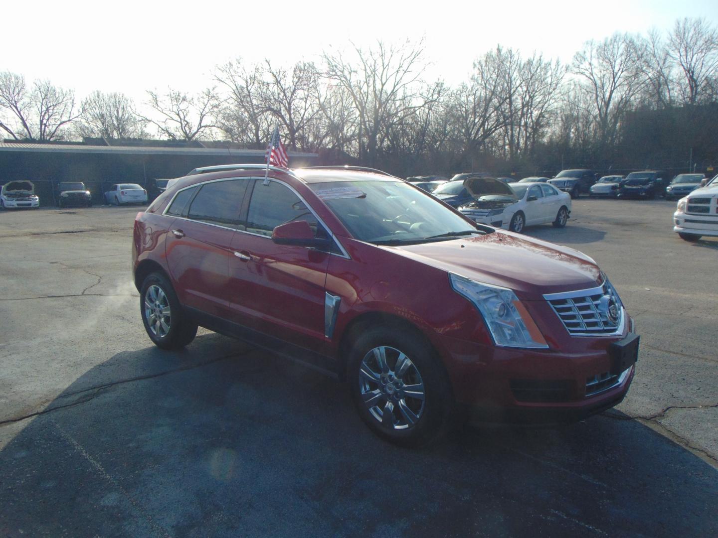 2016 Red Cadillac SRX (3GYFNBE37GS) with an V6 3.6 Liter engine, Auto, 6-Spd TAPshift transmission, located at 2105 Dixie Hwy, Louisville, KY, 40210, (502) 772-3333, 38.220932, -85.795441 - Photo#4